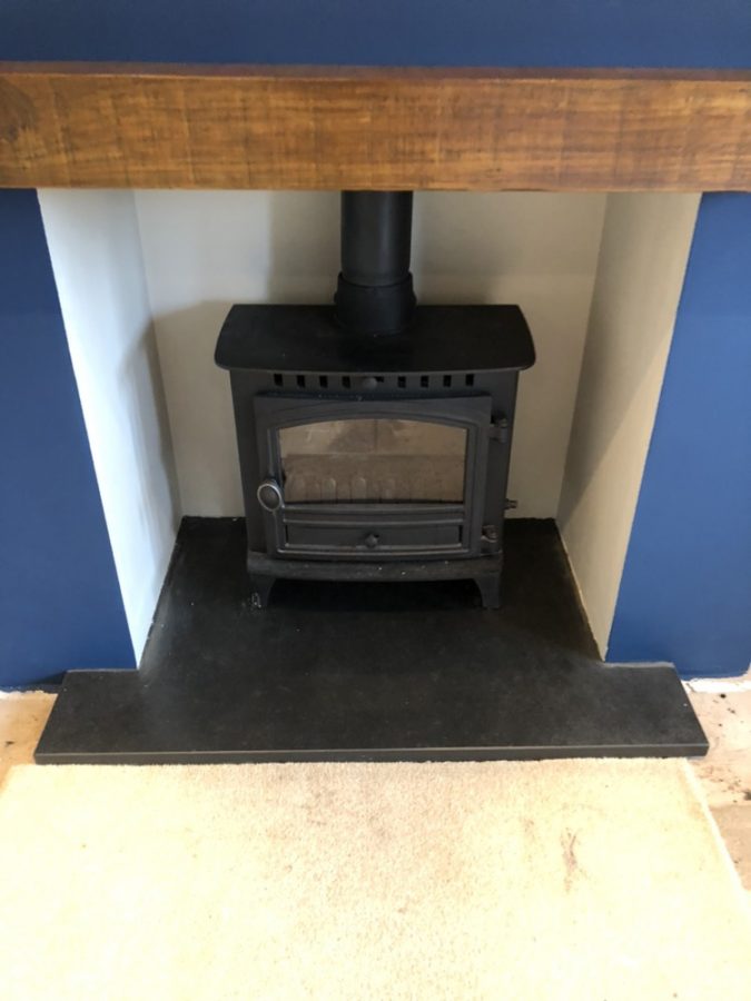 Fireplace with one of our made-to-measure T-shaped slate hearths