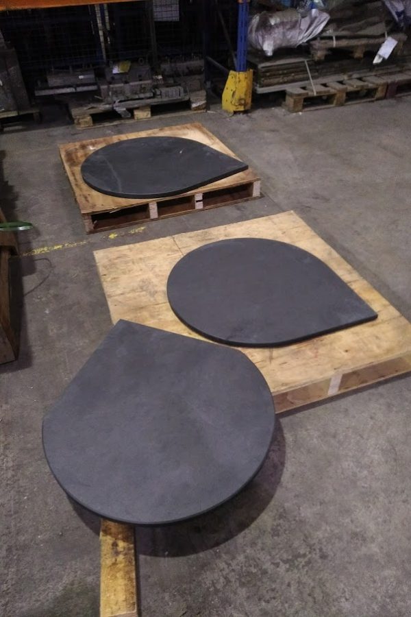 Three bespoke rounded circular slate hearths with right angles for a corner