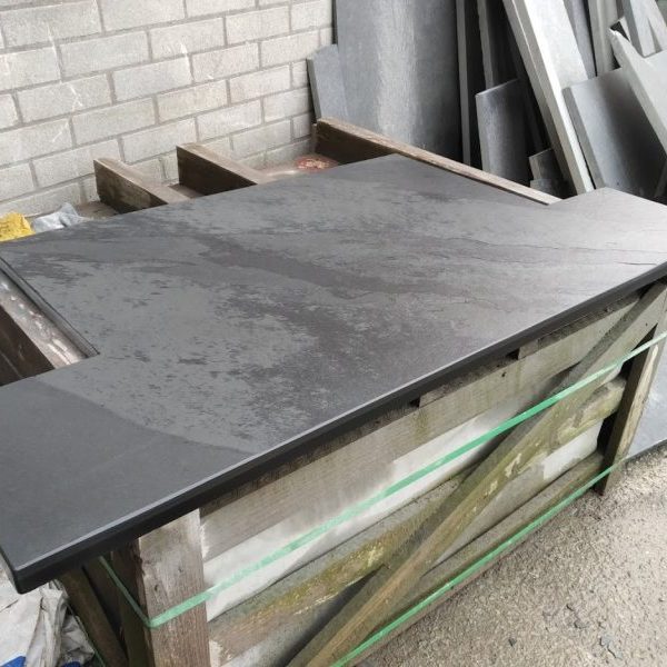 Bespoke T-shaped slate hearth at the end of preparation