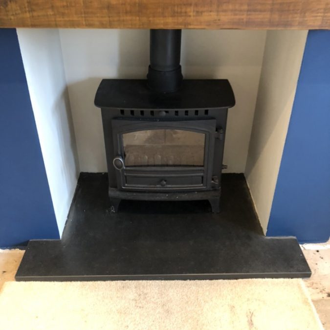 Fireplace with one of our made-to-measure T-shaped slate hearths