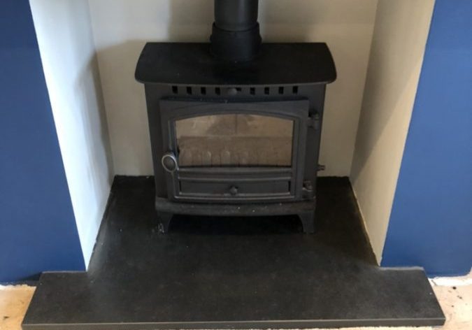 Fireplace with one of our made-to-measure T-shaped slate hearths