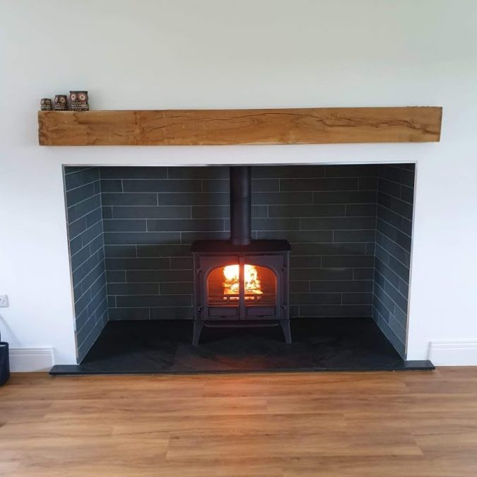 Perfect fitting made-to-measure slate hearth finishing off this stove and fireplace