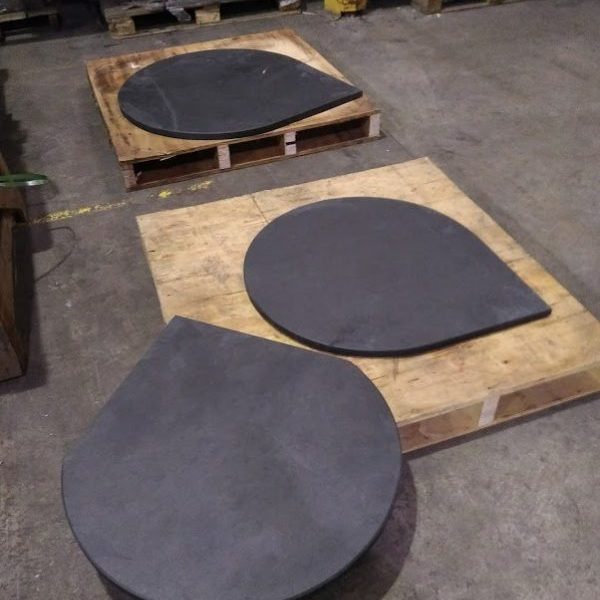 Three bespoke rounded circular slate hearths with right angles for a corner