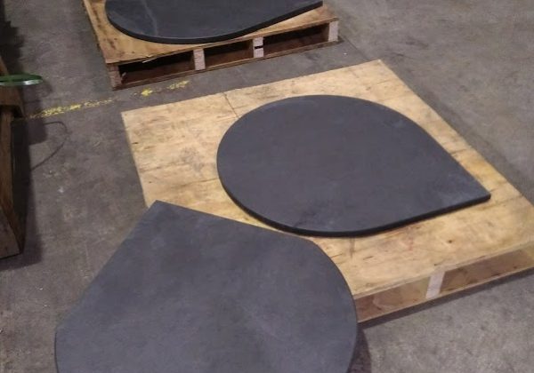 Three bespoke rounded circular slate hearths with right angles for a corner